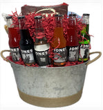 Pacific Northwest snacks and sodas inside a metal container wrapped with twine on the bottom and on the handles.