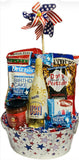 Gift basket with snacks and a bottle of sparkling white grape juice on a white background.