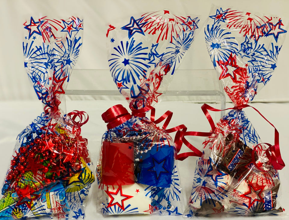 Decorative gift bags with red, white, and blue designs on a white background